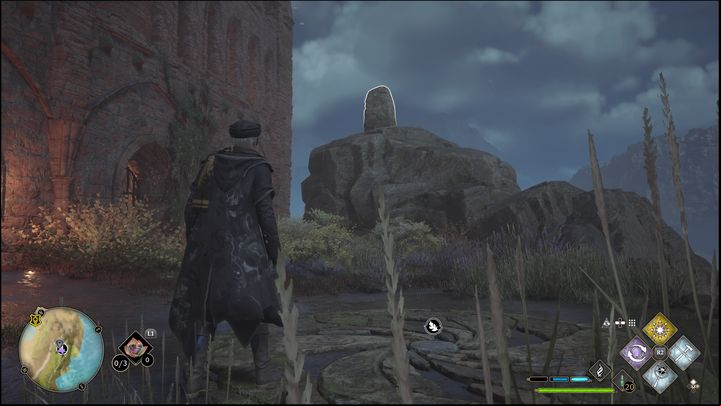 The task is to destroy five stone structures using spells such as Bombarda or Confringo - Hogwarts Legacy: Manor Cape - all Merlin Trials - Merlins Trials - Hogwarts Legacy Guide