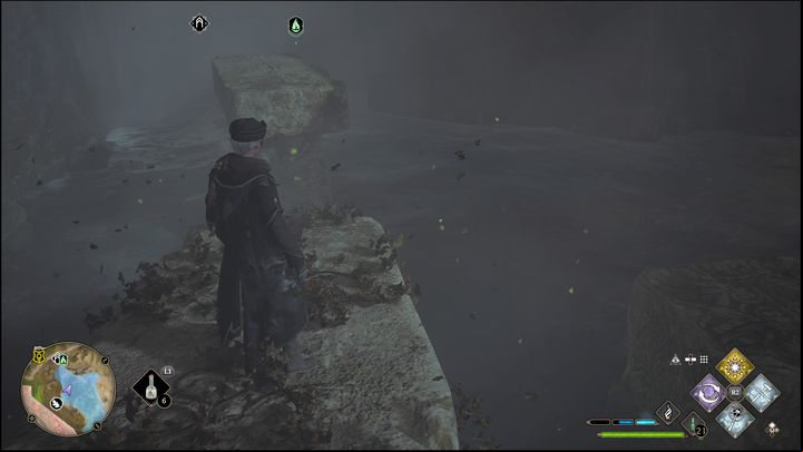 Once you're in the middle, instead of jumping to the platform below, first take a long run and jump over the chasm to catch the edge of the stone structure in front of you - Hogwarts Legacy: Poidsear Coast - all Merlin Trials - Merlins Trials - Hogwarts Legacy Guide