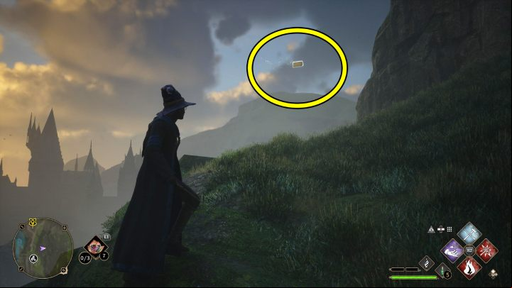 One of the Flying Guide Pages #6 (Hogsmeade) is flying above the hill on the western outskirts of the village, near the herb shop - Hogwarts Legacy: Field Guide Pages - Hogsmeade - Hogsmeade - Hogwarts Legacy Guide