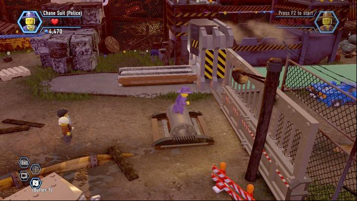 Roll over the cylinder across the gate and dash to move it - The Scrapyard | Walkthrough - Chapter 8 - LEGO City: Undercover Game Guide