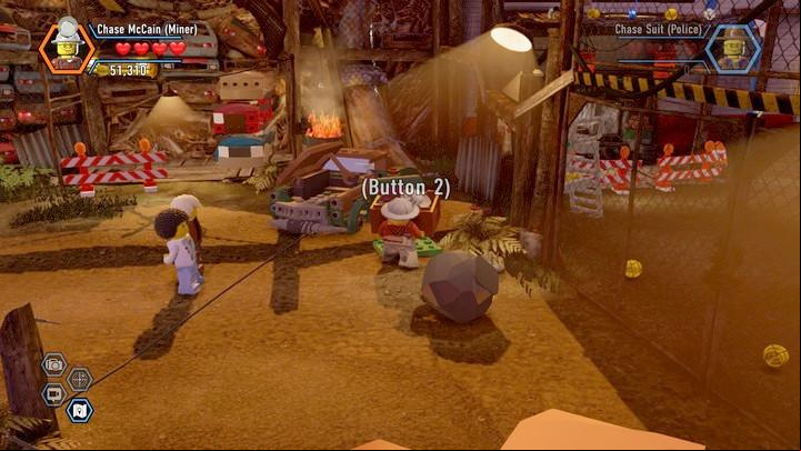 Take the crate near the gate. Use the parts inside to rebuild the vehicle and open the age. - The Scrapyard | Walkthrough - Chapter 8 - LEGO City: Undercover Game Guide