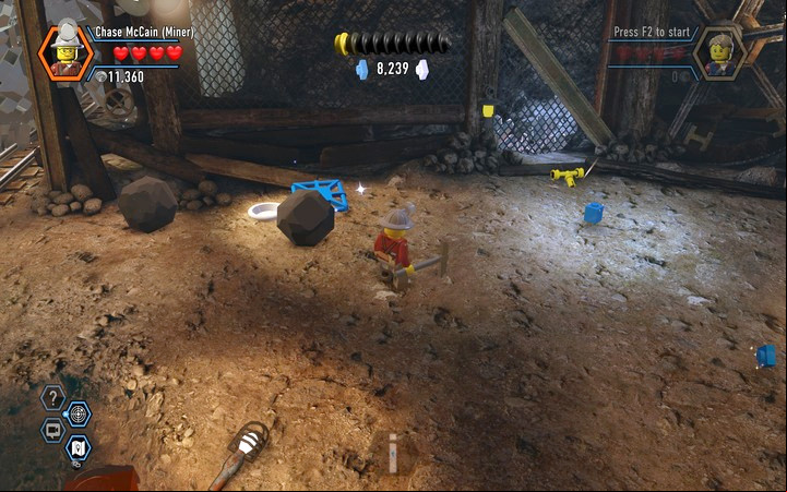 You will find a yellow switch beneath the boulders - The Bluebell Mine | Chapter 3 - Chapter 3 - LEGO City: Undercover Game Guide