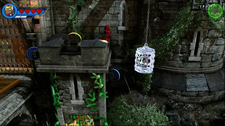 Fly towards the castle wall on the right (see screenshot), and destroy the silver cage to rescue Stan Lee - Mission 3 - Castle Hassle | Mission secrets - Mission secrets - LEGO Marvel Super Heroes 2 Game Guide