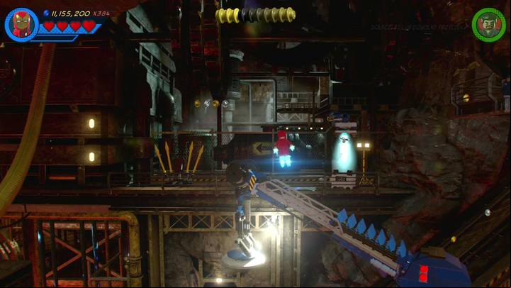 The fourth Minikit is on a balcony, right by the crane - Mission 4 - Whats Klaws is Minded | Mission secrets - Mission secrets - LEGO Marvel Super Heroes 2 Game Guide