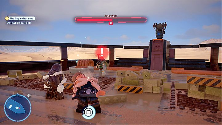 The boss uses a blaster and can also stop the hero in their position - in such case, quickly press the button visible on the screen to free yourself - LEGO Skywalker Saga: The Copa-Khetanna - walkthrough - Episode 6 - Return of the Jedi - LEGO Skywalker Saga Guide