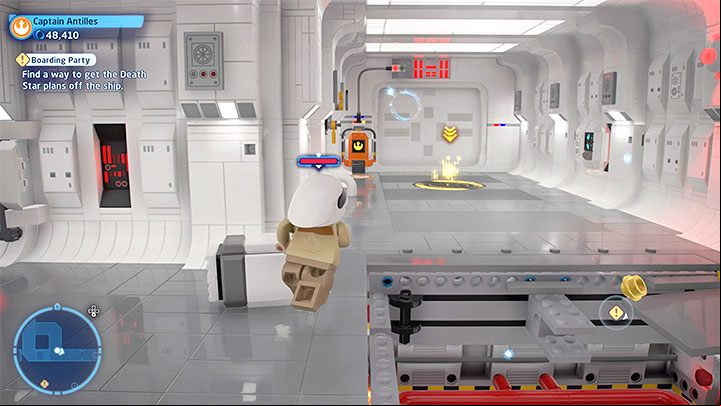 Switch to the second character, avoid the hole in the floor and reach the door with the terminal shown in the picture - LEGO Skywalker Saga: Boarding Party - walkthrough - Episode 4 - A New Hope - LEGO Skywalker Saga Guide