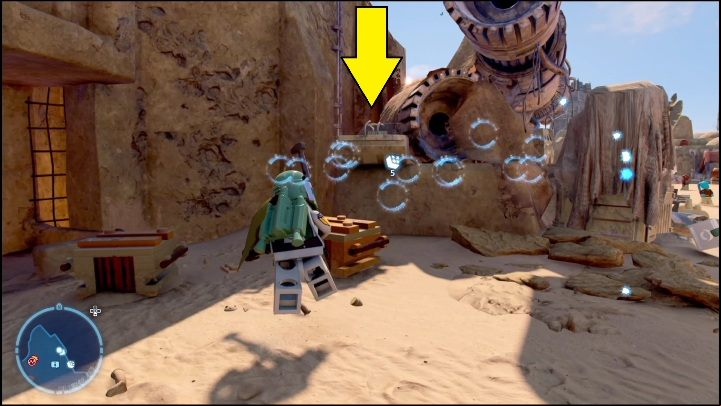The brick is in the northern part of the region, behind a pile of parts - LEGO Star Wars The Skywalker Saga: Mos Eisley - list of all puzzles - Tatooine - LEGO Skywalker Saga Guide