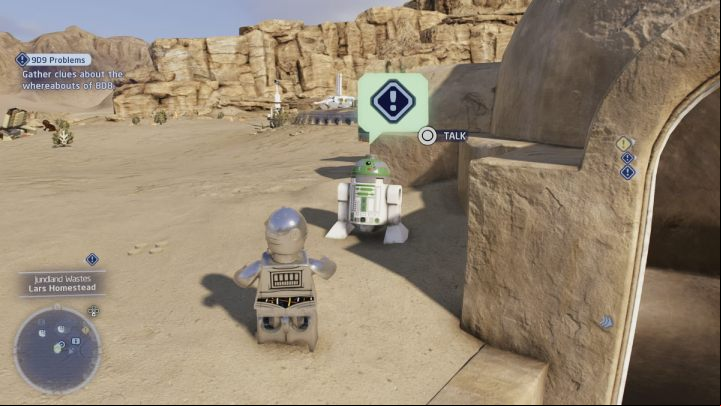 You will receive another clue from the astromechanical droid standing at the entrance to the building - LEGO Skywalker Saga: 9D9 Problems - walkthrough - Tatooine - the desert of Jundland - LEGO Skywalker Saga Guide