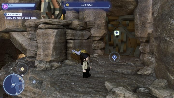 Follow the new marker on the screen and follow the trail left by the droid (these will be small, sparkling pieces) until you reach the door on the higher level of the rock, near the cave - LEGO Skywalker Saga: 9D9 Problems - walkthrough - Tatooine - the desert of Jundland - LEGO Skywalker Saga Guide