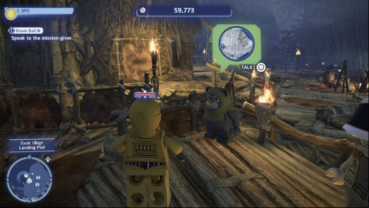 While controlling the protocol droid, talk to the NPC in the Ewok village and accept the quest - LEGO Skywalker Saga: Doom Ball III - walkthrough - Endor - the ewok village - LEGO Skywalker Saga Guide