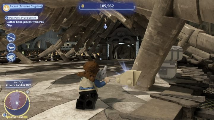 Follow the marker until you reach an area with a huge skeleton inside, then collect 10 bone pieces - LEGO Skywalker Saga: Pod Parts Procurement - walkthrough - Tatooine - Mos Espa - LEGO Skywalker Saga Guide