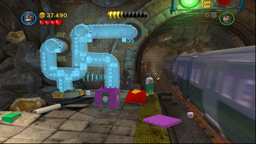 Move toward rails, where you will see blue bricks on the wall (picture) - Underground Retreat | Walkthrough - Walkthrough - LEGO Batman 2: DC Super Heroes Game Guide & Walkthrough