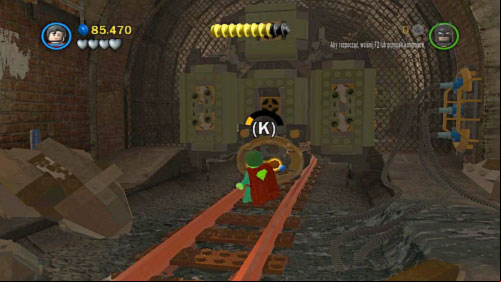 Get down move along tunnel and use Superman to pull the orange handle (picture) and continue march along tunnel - Underground Retreat | Walkthrough - Walkthrough - LEGO Batman 2: DC Super Heroes Game Guide & Walkthrough