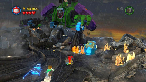 Move on the other side and extinguish fire near electric device on top (picture) - Tower Defiance | Walkthrough - Walkthrough - LEGO Batman 2: DC Super Heroes Game Guide & Walkthrough