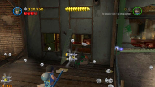 #10 - In location where you are fighting with Joker - there are three green plates in windows - Theatrical Pursuits | Minikits - Minikits - LEGO Batman 2: DC Super Heroes Game Guide & Walkthrough