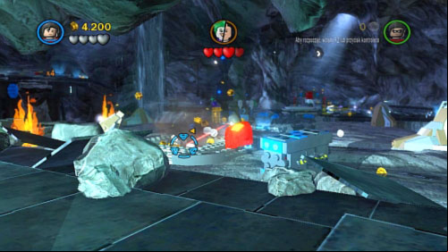 #03 - In the left side of cave is platform with golden middle - destroy it with laser and jump into the hole - Unwelcome Guests | Minikits - Minikits - LEGO Batman 2: DC Super Heroes Game Guide & Walkthrough