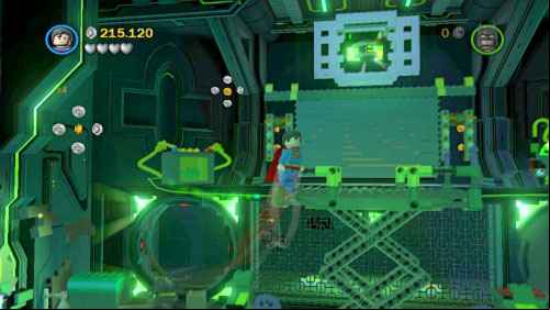 #03 - In the same location use Lex to destroy one of the black screens, move behind the fence, destroy black bricks and use both heroes to stand on the buttons (minikit will show under the ceiling) - Destination Metropolis | Minikits - Minikits - LEGO Batman 2: DC Super Heroes Game Guide & Walkthrough