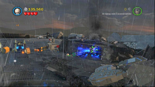 #10 - On the right side of plaza where you are fighting with robot, there is black container - Tower Defiance | Minikits - Minikits - LEGO Batman 2: DC Super Heroes Game Guide & Walkthrough