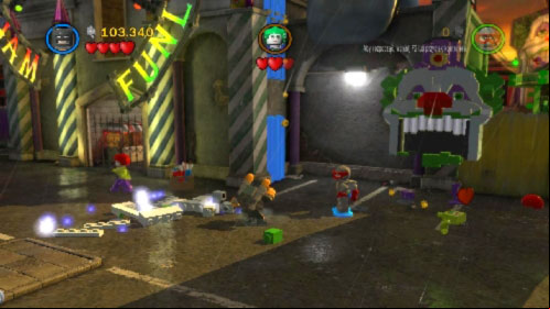 After that move to the top right corner of the location and use bricks to build a Jokers face on the wall (picture) - Harboring a Criminal | Walkthrough - Walkthrough - LEGO Batman 2: DC Super Heroes Game Guide & Walkthrough