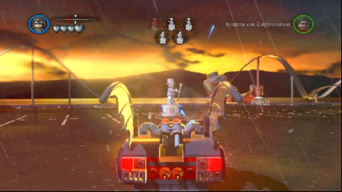 Choose one of the vehicles, get inside, start driving and launch rockets at silver statues (picture) (K key) - Arkham Asylum Antics - prologue | Walkthrough - Walkthrough - LEGO Batman 2: DC Super Heroes Game Guide & Walkthrough