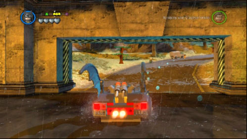 After destroying 5 statues the wide gate will open (picture), through it and start driving along the road toward batsign (its marked on the top left corner) - Arkham Asylum Antics - prologue | Walkthrough - Walkthrough - LEGO Batman 2: DC Super Heroes Game Guide & Walkthrough