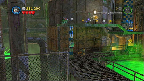 In the next area destroy silver bricks on the right side and use pole to move Robin on the higher floor (picture) - Chemical Crisis | Walkthrough - Walkthrough - LEGO Batman 2: DC Super Heroes Game Guide & Walkthrough