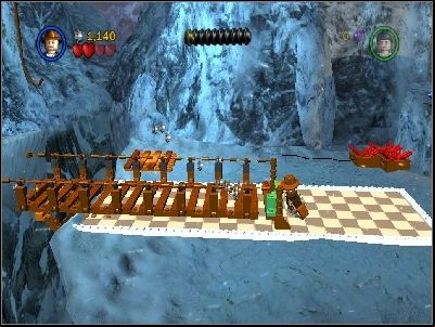 Go to the right using the bars and use your whip on the highlighted place near the edge - Chapter 2 - Into the Mountains - part 1 - Riders of the Lost Ark - LEGO Indiana Jones: The Original Adventures - Game Guide and Walkthrough
