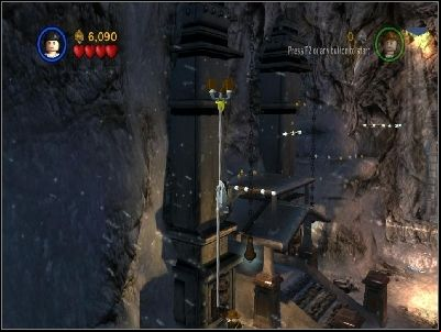 As Marion climb up using this rope and use the brown bars to get on the bat statue - Chapter 2 - Into the Mountains - part 2 - Riders of the Lost Ark - LEGO Indiana Jones: The Original Adventures - Game Guide and Walkthrough