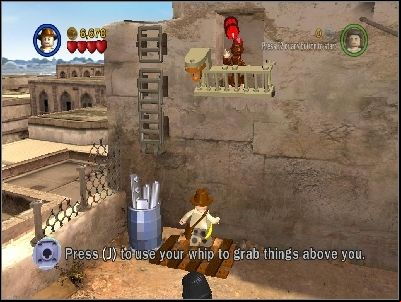 Use your whip under the monkey to destroy the barrier - Chapter 3 - City of Danger - part 2 - Riders of the Lost Ark - LEGO Indiana Jones: The Original Adventures - Game Guide and Walkthrough