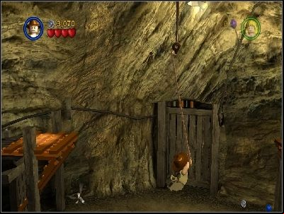 As Indy get on the repaired lift and use your whip on highlighted place - Chapter 4 - Free the Slaves - part 2 - The Temple of Doom - LEGO Indiana Jones: The Original Adventures - Game Guide and Walkthrough