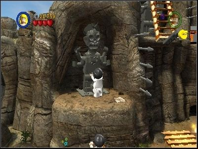 As Willie jump on the ledge and use grey statue - Chapter 6 - Battle on the Bridge - The Temple of Doom - LEGO Indiana Jones: The Original Adventures - Game Guide and Walkthrough