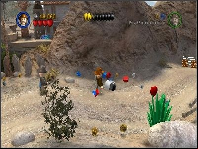 Now you must destroy three tractors and take LEGO pieces to the green pads near the house - Chapter 4 - Trouble in the Sky - The Last Crusade - LEGO Indiana Jones: The Original Adventures - Game Guide and Walkthrough