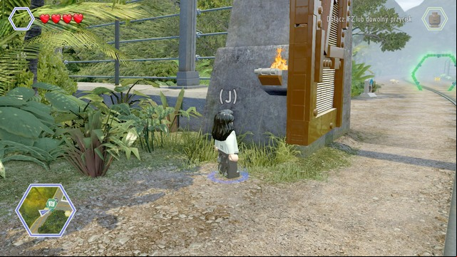 Second golden brick can be found above the gate - Jurassic Park Gate | Jurassic Park - secrets in free roam - Jurassic Park - secrets in free roam - LEGO Jurassic World Game Guide & Walkthrough