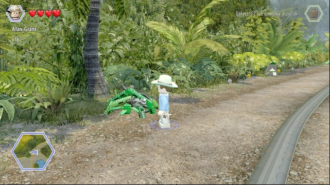 As Grant, walk to the plants blocking the bricks and cut them - Visitors Center | Jurassic Park - secrets in free roam - Jurassic Park - secrets in free roam - LEGO Jurassic World Game Guide & Walkthrough