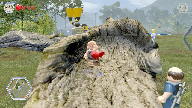 Second item, an apple, can be found hidden in tree trunk - Gallimimus Territory | Jurassic Park - secrets in free roam - Jurassic Park - secrets in free roam - LEGO Jurassic World Game Guide & Walkthrough