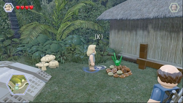 As Ellie, walk to the pile of ground shown on the picture and water it up - Carnivore Territory | Jurassic Park - secrets in free roam - Jurassic Park - secrets in free roam - LEGO Jurassic World Game Guide & Walkthrough