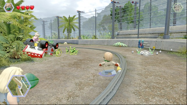 As Eric, scare away the compsognathuses by throwing the tyrannosaurus smell at them - Carnivore Territory | Jurassic Park - secrets in free roam - Jurassic Park - secrets in free roam - LEGO Jurassic World Game Guide & Walkthrough