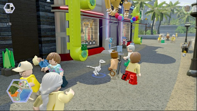 While on the street, switch your character to compsognathus and enter the green pipes shown on the picture - Main Street | Jurassic World - secrets in free roam - Jurassic World - secrets in free roam - LEGO Jurassic World Game Guide & Walkthrough