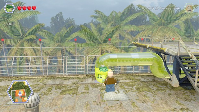After finishing the race, change your character to compsognathus and enter the pipe - Communications Center | Jurassic Park - The Lost World - secrets in free roam - Jurassic Park - The Lost World - secrets in free roam - LEGO Jurassic World Game Guide & Walkthrough