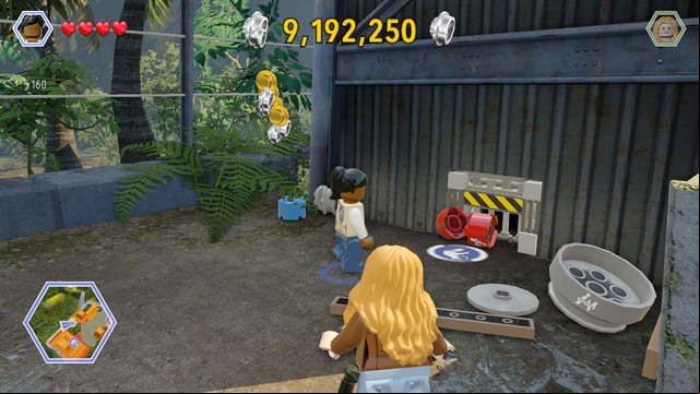 Walk behind the building and destroy all the barrels that block access to the age - Communications Center | Jurassic Park - The Lost World - secrets in free roam - Jurassic Park - The Lost World - secrets in free roam - LEGO Jurassic World Game Guide & Walkthrough