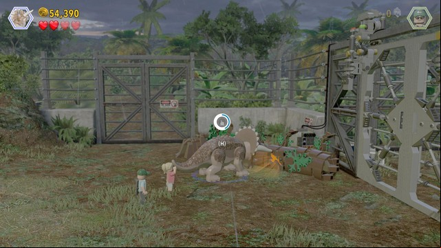As the triceratops, approach the gate on the right and destroy the orange object that you can see in the screenshot - Welcome to Jurassic Park | Jurassic Park - walkthrough - Jurassic Park - walkthrough - LEGO Jurassic World Game Guide & Walkthrough