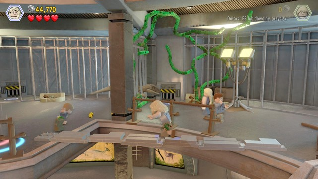 After the bricks spill over the ground, build a footbridge that all of your companions can use to get to the other side - Visitor center | Jurassic Park - walkthrough - Jurassic Park - walkthrough - LEGO Jurassic World Game Guide & Walkthrough