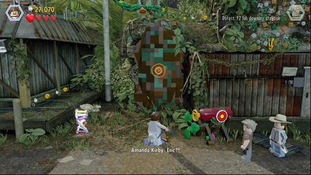 After you reach the airstrip, as Paul, approach the spot shown in the screenshot and use the rope to gain access - Landing Strip | Jurassic Park III - walkthrough - Jurassic Park III - walkthrough - LEGO Jurassic World Game Guide & Walkthrough
