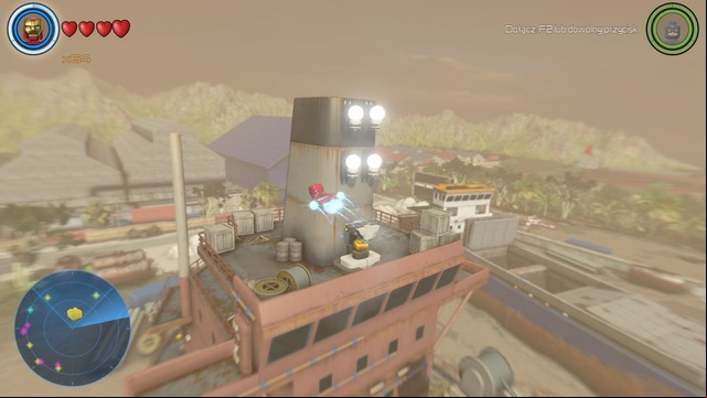 In order to open the container shown on the picture that contains a golden brick you must light up the four lamps above it - Golden bricks - South Africa - secrets - LEGO Marvels Avengers - Game Guide and Walkthrough