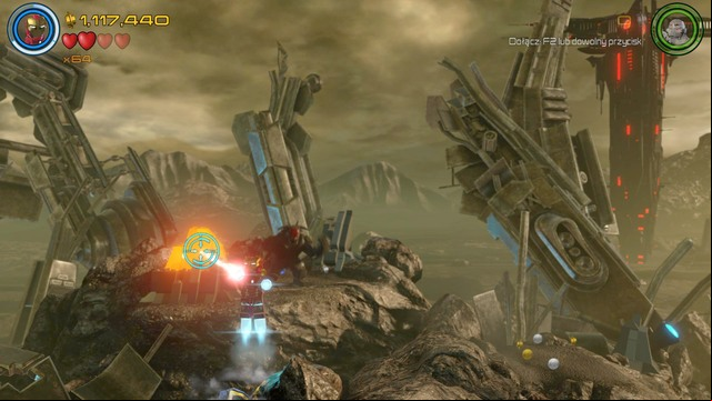 Fly on the platform shown on the picture during the battle with boss and use laser to destroy the golden container - Minikits - Lost in the Aether - secrets - LEGO Marvels Avengers - Game Guide and Walkthrough