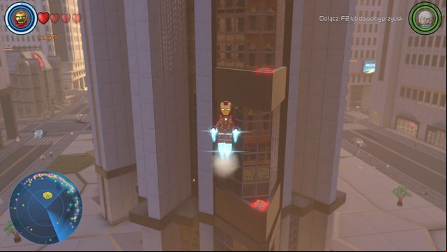 At the roof of the middle skyscraper you will find a container that can be opened by activating eight switches - Golden bricks - North Manhattan - secrets - LEGO Marvels Avengers - Game Guide and Walkthrough