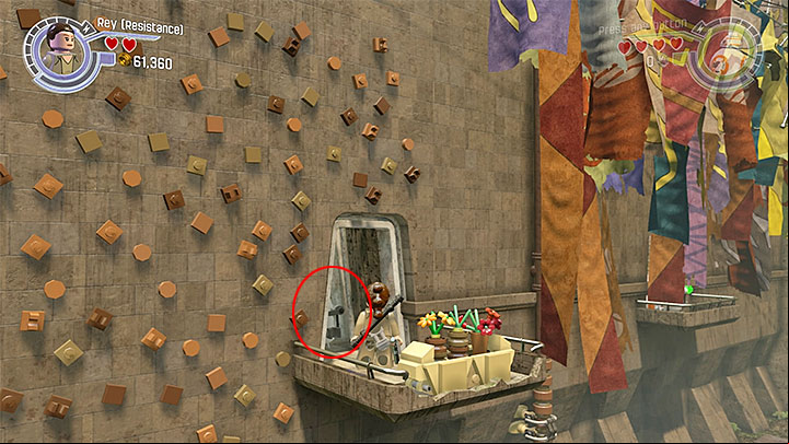 This minikit is on a small balcony with a plant pot - Chapter 5 - Mazs Castle | Minikits and red bricks - Minikits and red LEGO bricks - LEGO Star Wars: The Force Awakens Game Guide