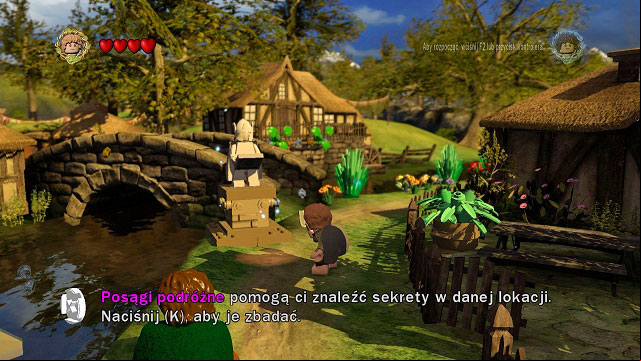 Around the middle of town you will find one of many map stones - Middle-Earth: Hobbiton - Walkthrough - Act I - LEGO The Lord of the Rings - Game Guide and Walkthrough
