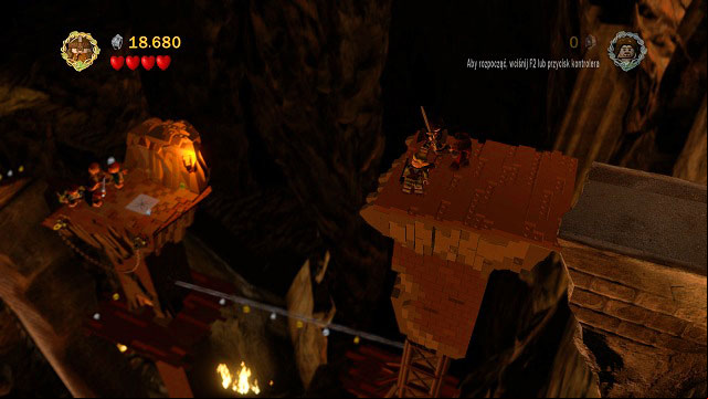 Run down the stairs and you will by a statue which you can use to save your game - The Mines of Moria - Walkthrough - Act I - LEGO The Lord of the Rings - Game Guide and Walkthrough