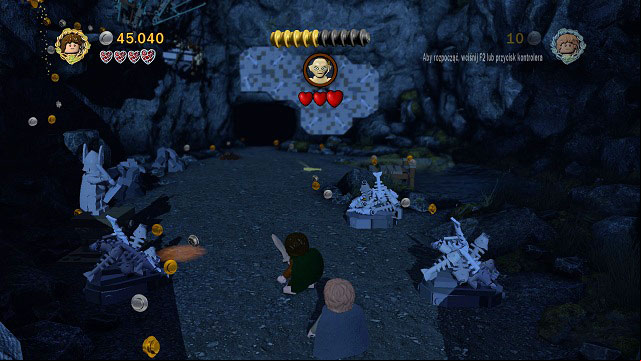 Gollum will be constantly moving along the opposite wall - to make him come down, you need to throw a fish at him - Taming Gollum - Walkthrough - Act II - LEGO The Lord of the Rings - Game Guide and Walkthrough